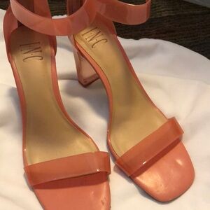 Lightly worn translucent pink heels